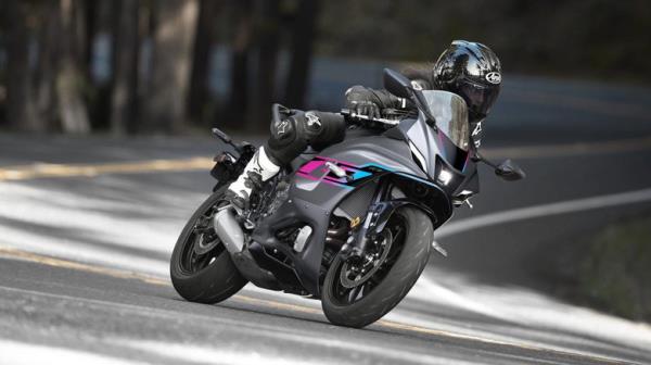 person riding black yamaha yzf-r7