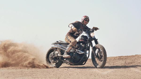 person riding yamaha scr950