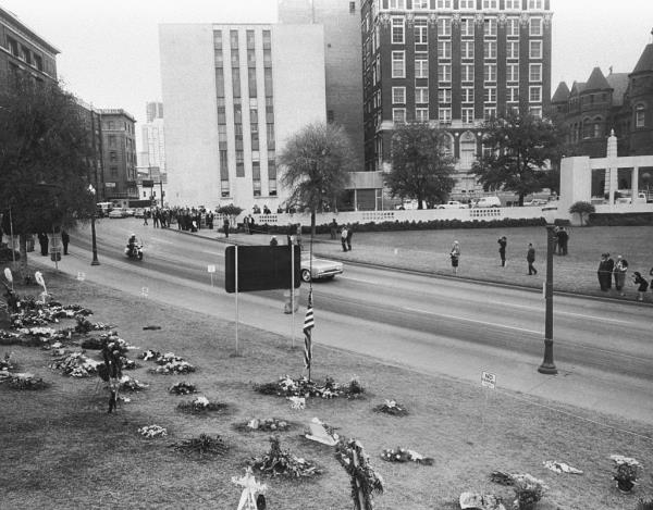 Flowers line the street in Dealey Plaza, at the site of the assassination of President John F. Kennedy.